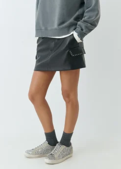 Falda mini efecto piel tachas*Brownie Sale